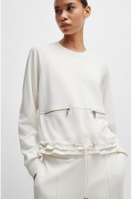 POLERA RELAXED FIT CON DOBLADILLO AJUSTABLE Y DETALLES DE CREMALLERA MUJER