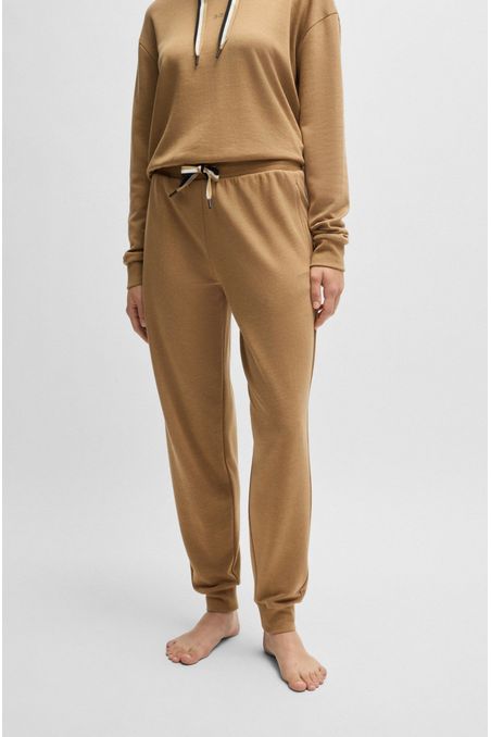 PANTALONES DE PIJAMA CON PUÑOS Y RAYAS DE LA MARCA EN EL CORDÓN MUJER