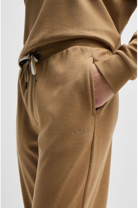 PANTALONES DE PIJAMA CON PUÑOS Y RAYAS DE LA MARCA EN EL CORDÓN MUJER