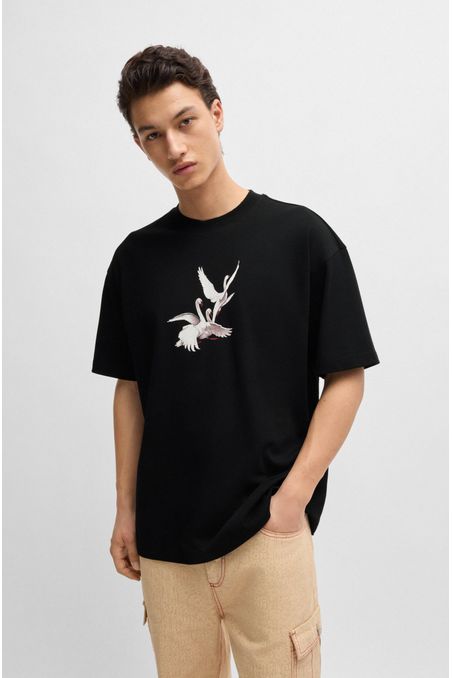 POLO HUGO X LES BENJAMINS OVERSIZE FIT CON GRÁFICO DE CISNES HOMBRE