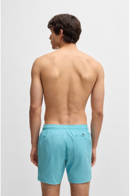 TRAJE DE BAÑO CON LOGO ESTAMPADO VERTICAL TRAJE DE BAÑO HOMBRE