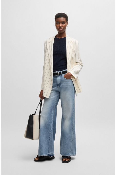 JEANS DE PERNERA ACAMPANADA EN CÓMODO DENIM ELÁSTICO EN TONO AZUL JEANS MUJER